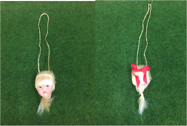 No 4 Official Porcelain Dolls head for Cross n Patch Angel patterns. Blonde hair in a plait with red ribbon.